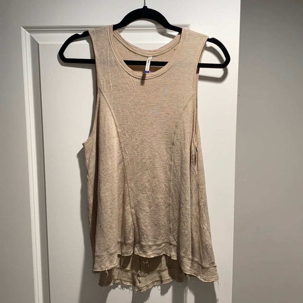 Tan tank top, light weight for summer. Small spot on top shoulder from a marker.